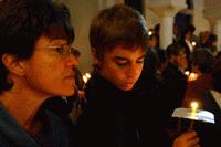 Therese and Peter reflect under candlelight the celebration of Easter